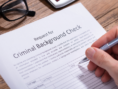 signing a criminal background check request form