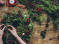Person makes their own Christmas wreath.