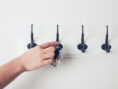 Living room hooks help this apartment goer keep track of their keys.