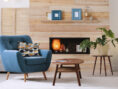Cozy furnished apartment with modern fireplace and armchair.