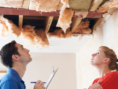 inspector and renter looking at apartment ceiling