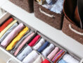 Breezy summer clothes neatly stored away in a drawer under the bed.
