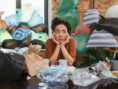 Common decorating mistakes and clutter make a young woman's small apartment feel even smaller.